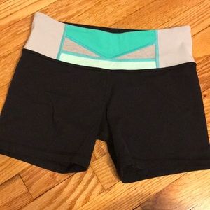 Black Lululemon spandex shorts with turquoise band